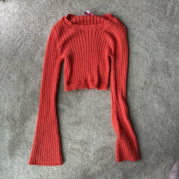 cropped, ribbed knit sweater in a vibrant orange-red color - Picture 1 of 3